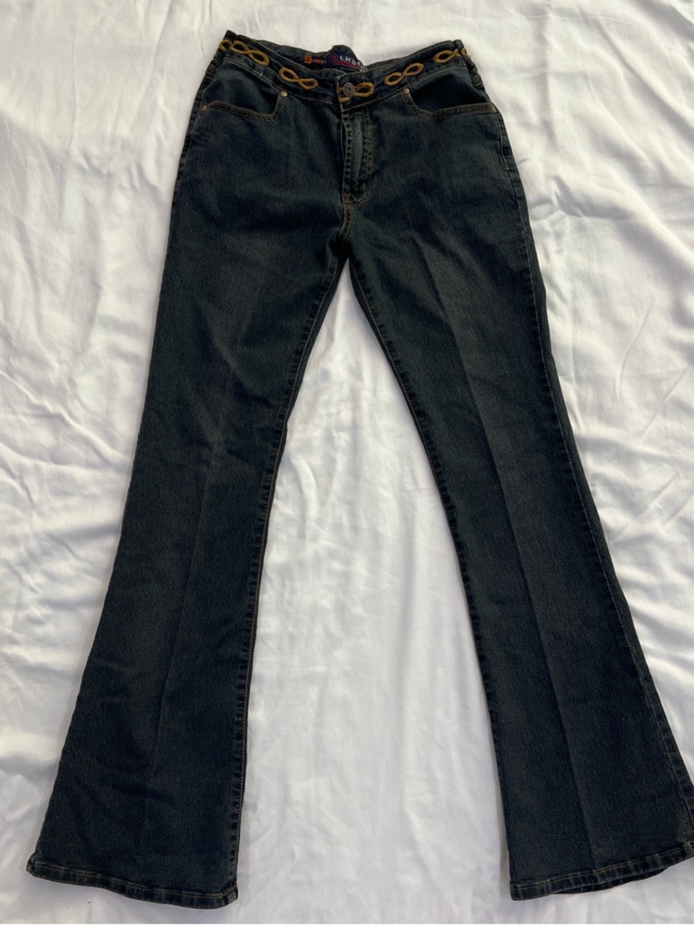 High-Rise Black Flare Jeans with Decorative Waist Detail